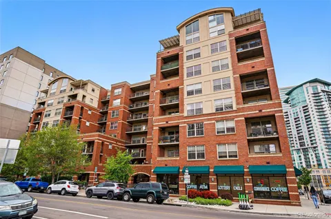 a group of potted plants in front of a building