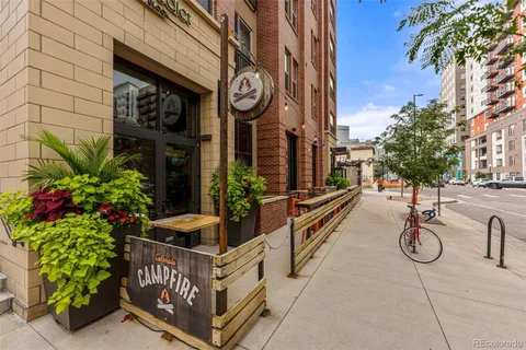 a view of path along with retail shop and buildings