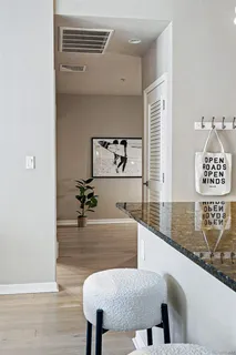 a view of kitchen island with furniture and wooden floor