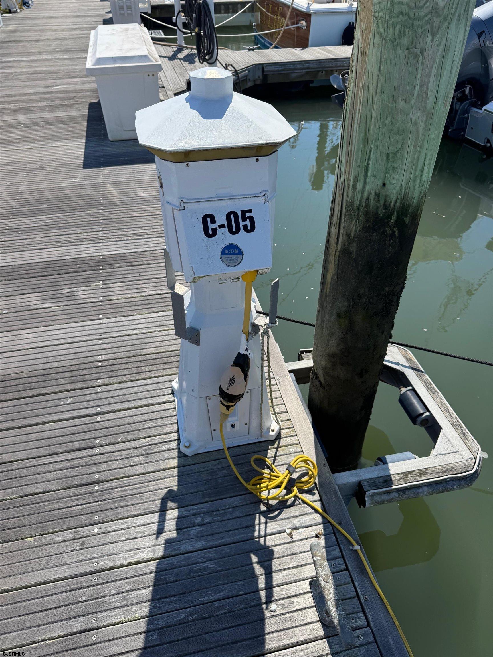 303 Longport Drive, Unit C5 (BOAT SLIP) Longport, NJ 08403 - Photo 2 of 6 a view of barbeque area with seating area