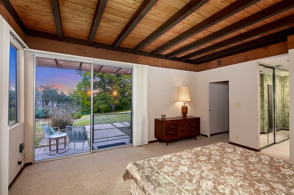 15022 Paso Del Sol Del Mar, CA 92014 - Photo 11 of 25 a bedroom with furniture and large windows