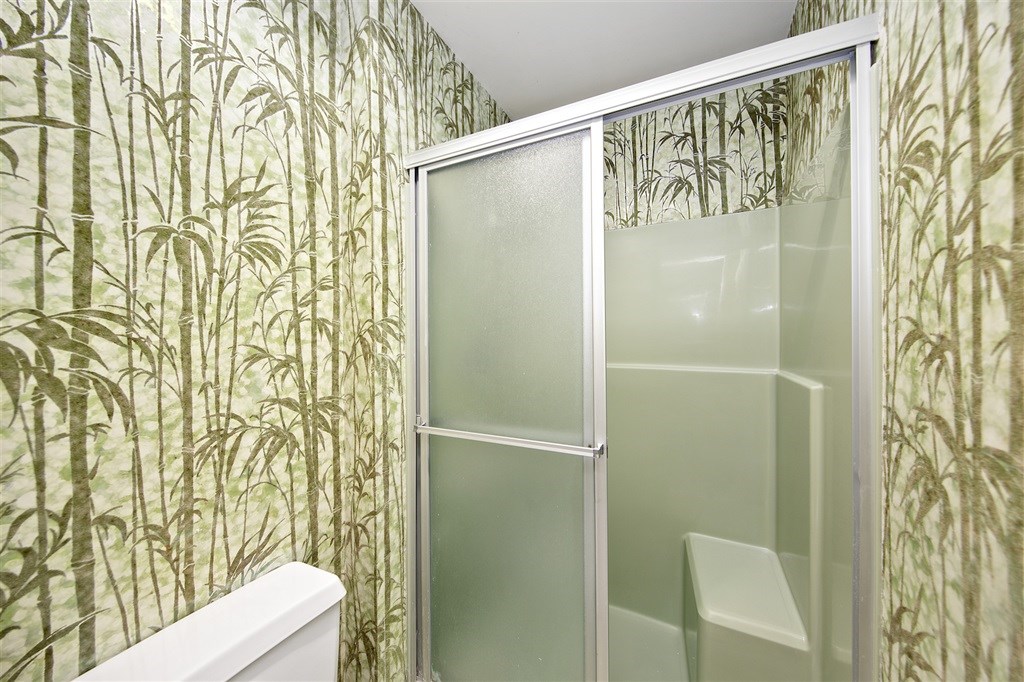 15022 Paso Del Sol Del Mar, CA 92014 - Photo 12 of 25 a bathroom with a shower curtain and a toilet