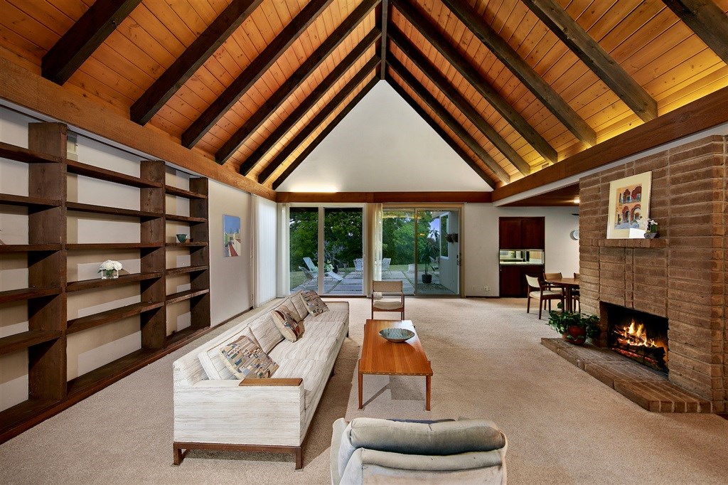15022 Paso Del Sol Del Mar, CA 92014 - Photo 4 of 25 a living room with furniture a fireplace and a large window