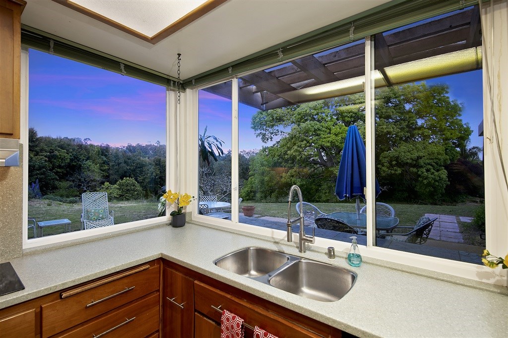 15022 Paso Del Sol Del Mar, CA 92014 - Photo 9 of 25 a sink with glass windows and yard