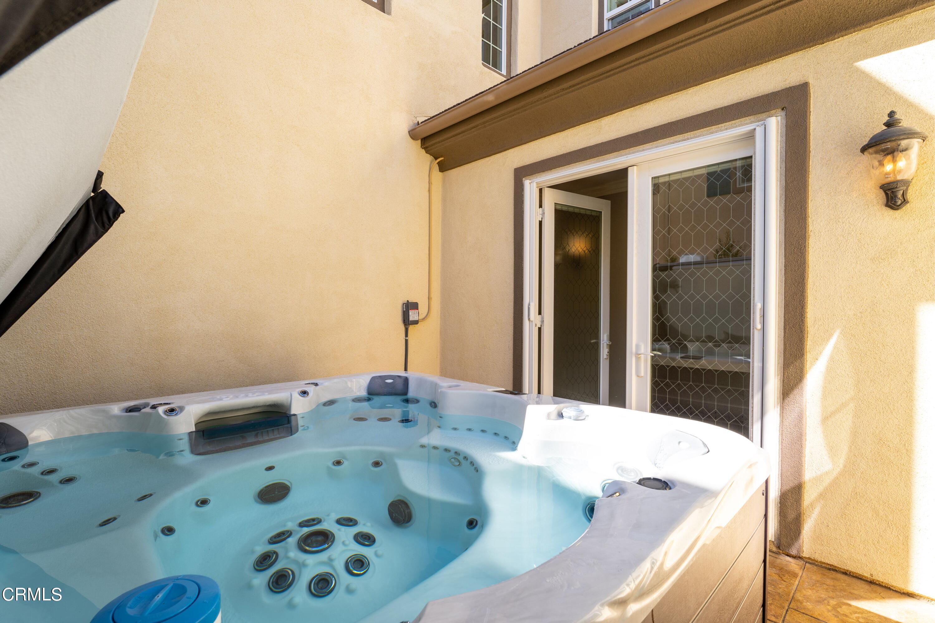 1544 Twin Tides Place Oxnard, CA 93035 - Photo 11 of 49 a bathroom with a tub sink and mirror