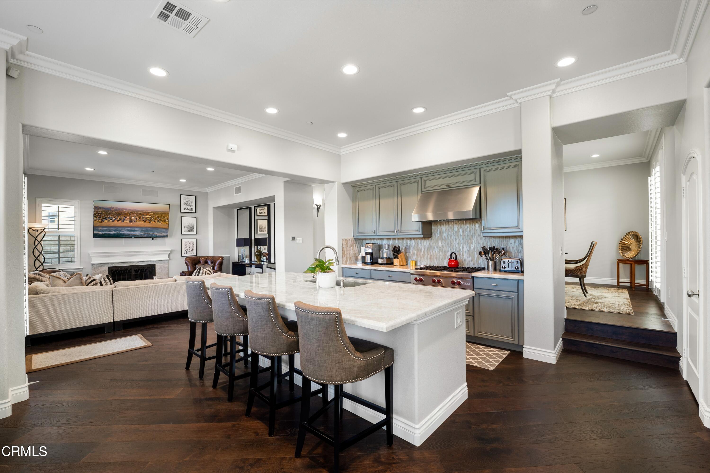 1544 Twin Tides Place Oxnard, CA 93035 - Photo 14 of 49 a kitchen with appliances and chairs