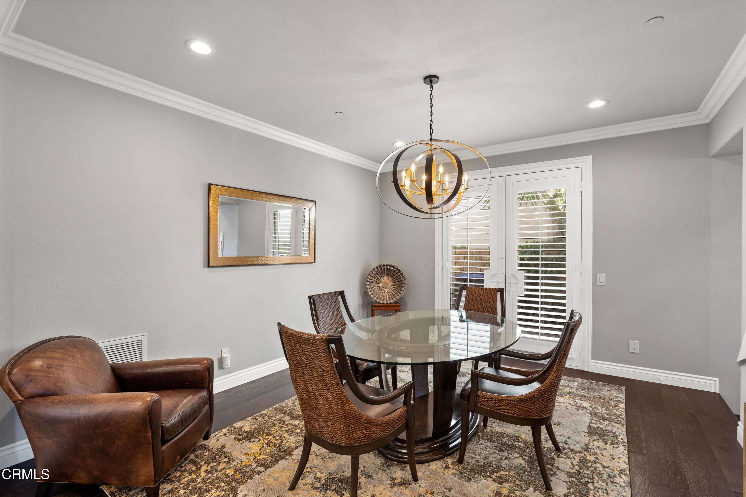1544 Twin Tides Place Oxnard, CA 93035 - Photo 20 of 49 a view of a dining room with furniture and chandelier