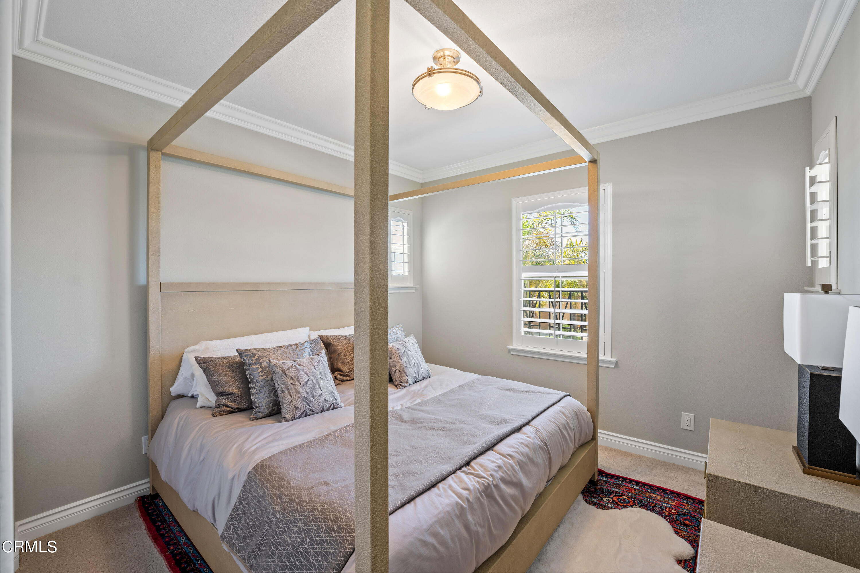 1544 Twin Tides Place Oxnard, CA 93035 - Photo 35 of 49 a bedroom with a bed and a table in it