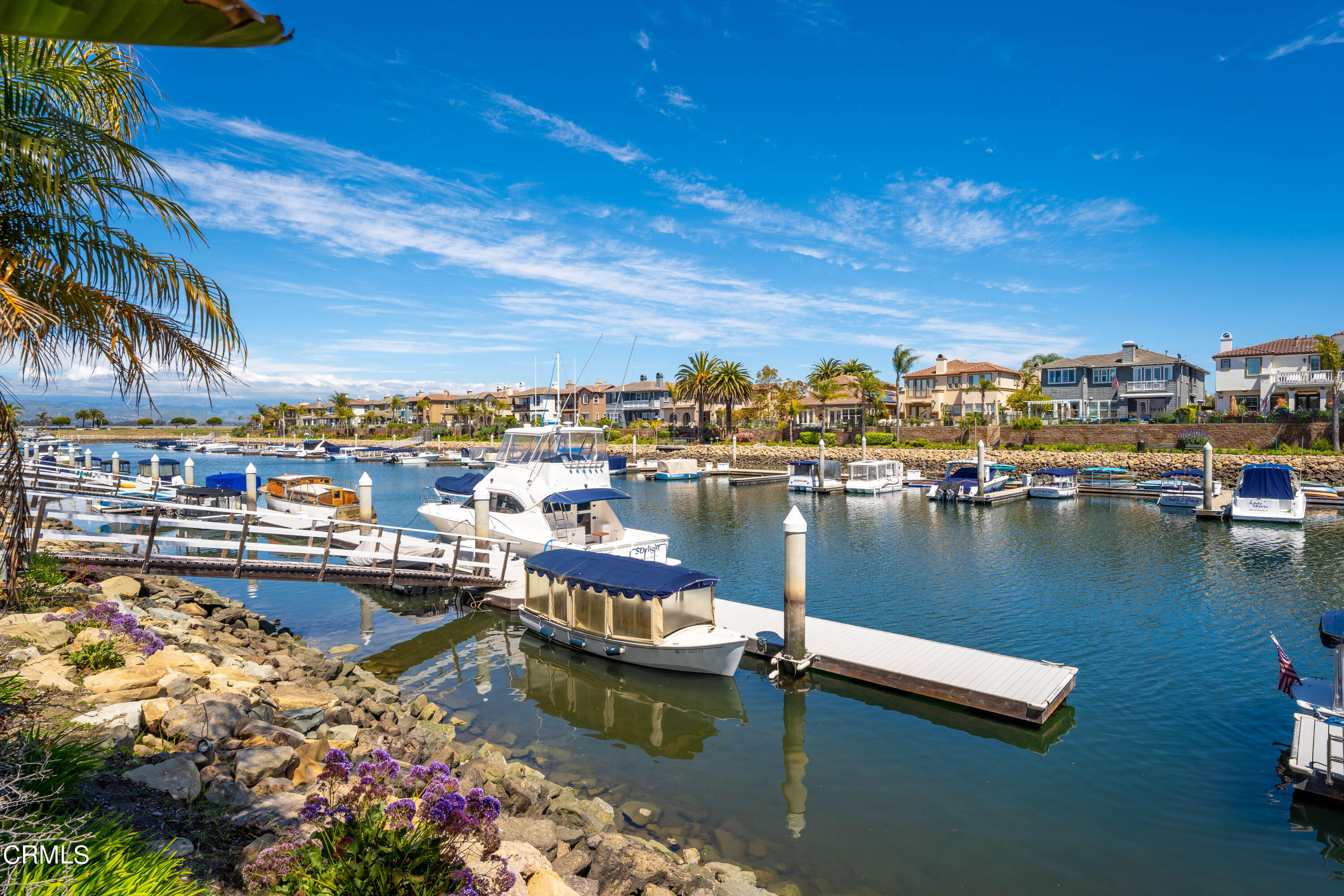 1544 Twin Tides Place Oxnard, CA 93035 - Photo 4 of 49 a view of a lake with a house