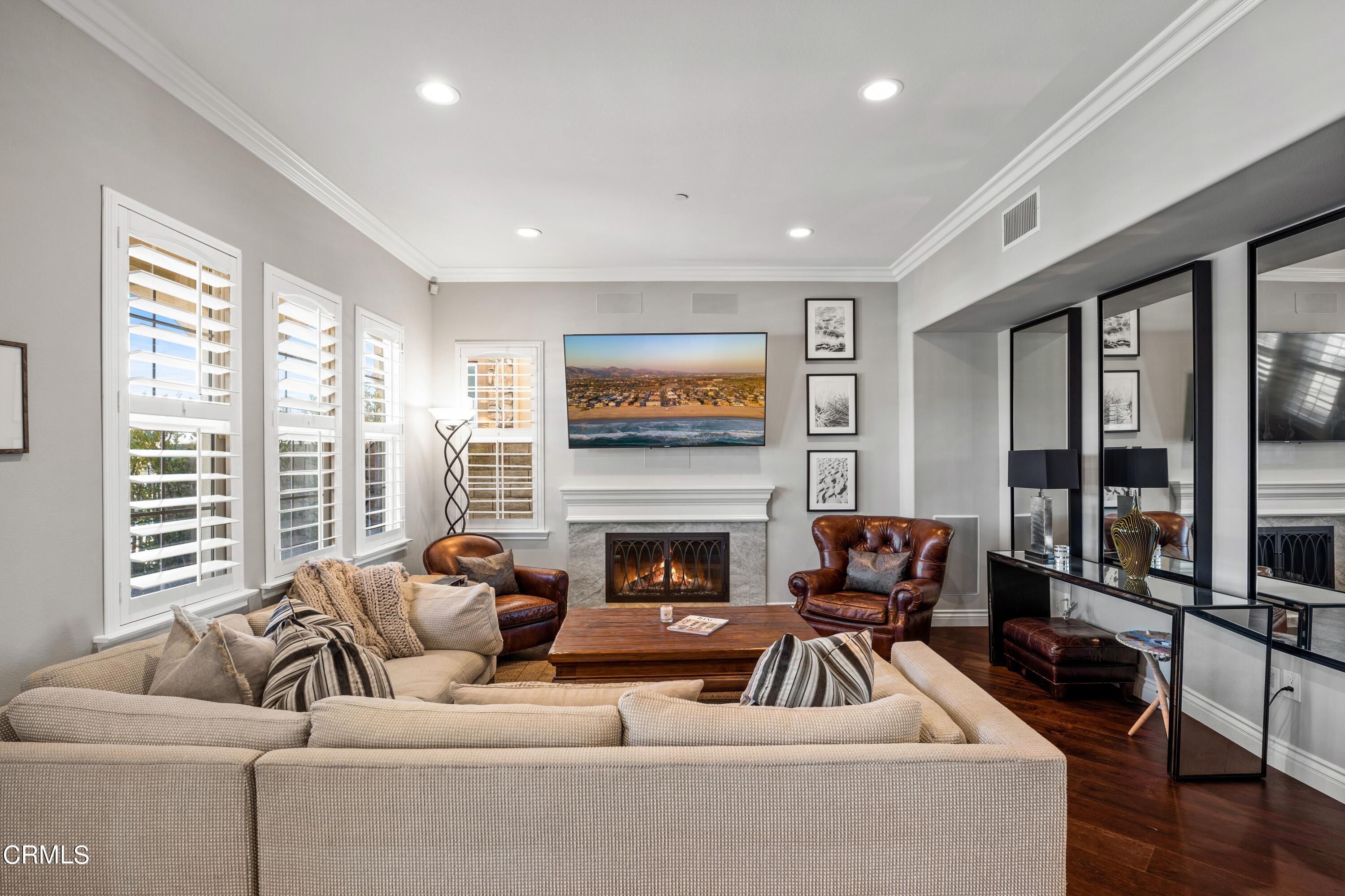 1544 Twin Tides Place Oxnard, CA 93035 - Photo 7 of 49 a living room with furniture and a fireplace
