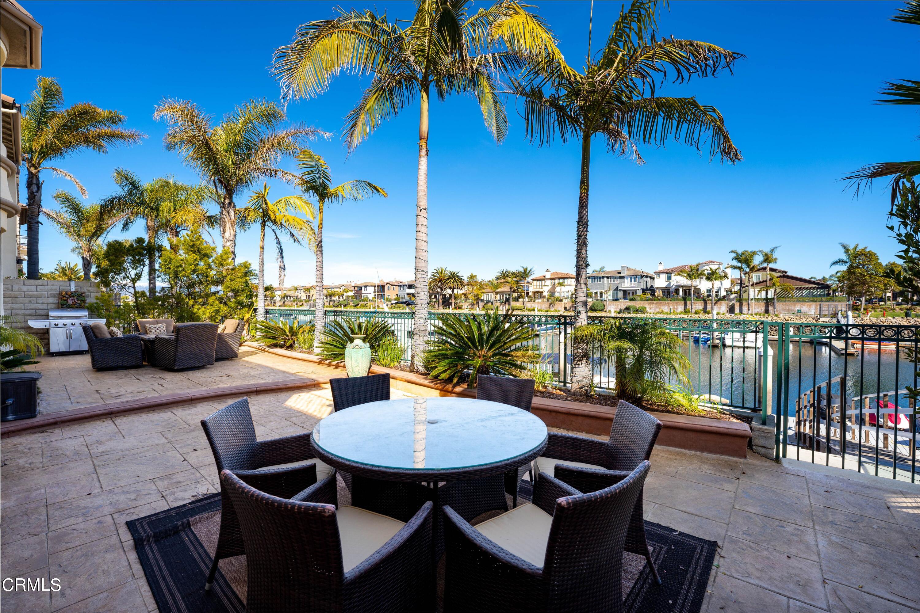 1544 Twin Tides Place Oxnard, CA 93035 - Photo 9 of 49 a view of a chairs and table in patio