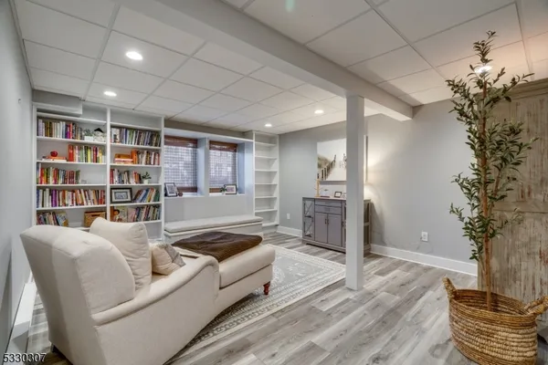 a living room with furniture window and wooden floor