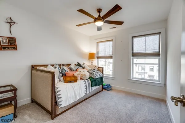 a bedroom with bed and window