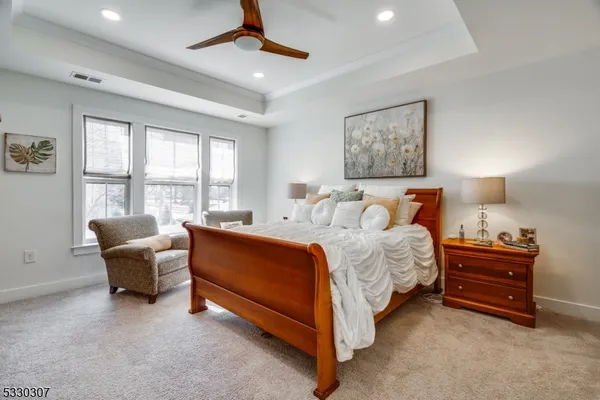 a bed room with a bed and a chair