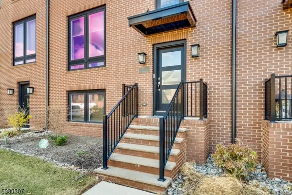 a view of a house with backyard and deck