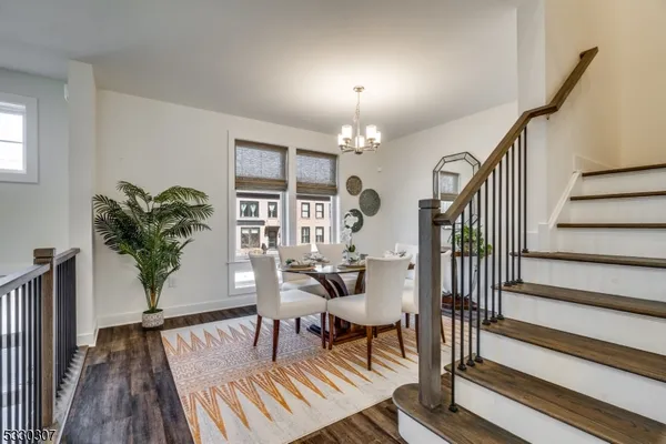 a view of a livingroom with furniture and lounge chair