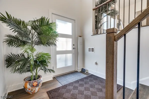 a view of entryway with flower plants