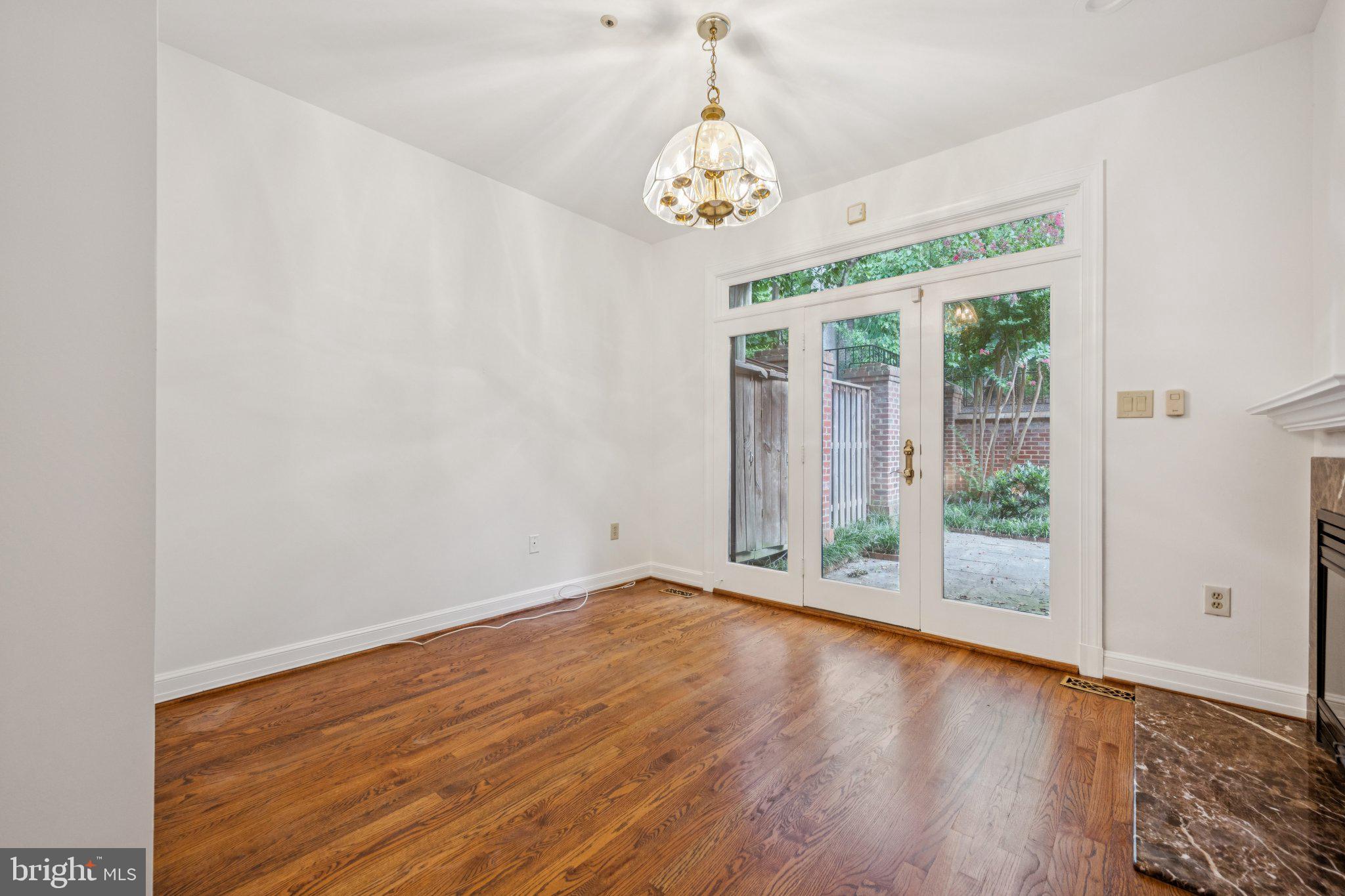 5819 Madaket Road Bethesda, MD 20816 - Photo 16 of 50 a view of an empty room with wooden floor and a window