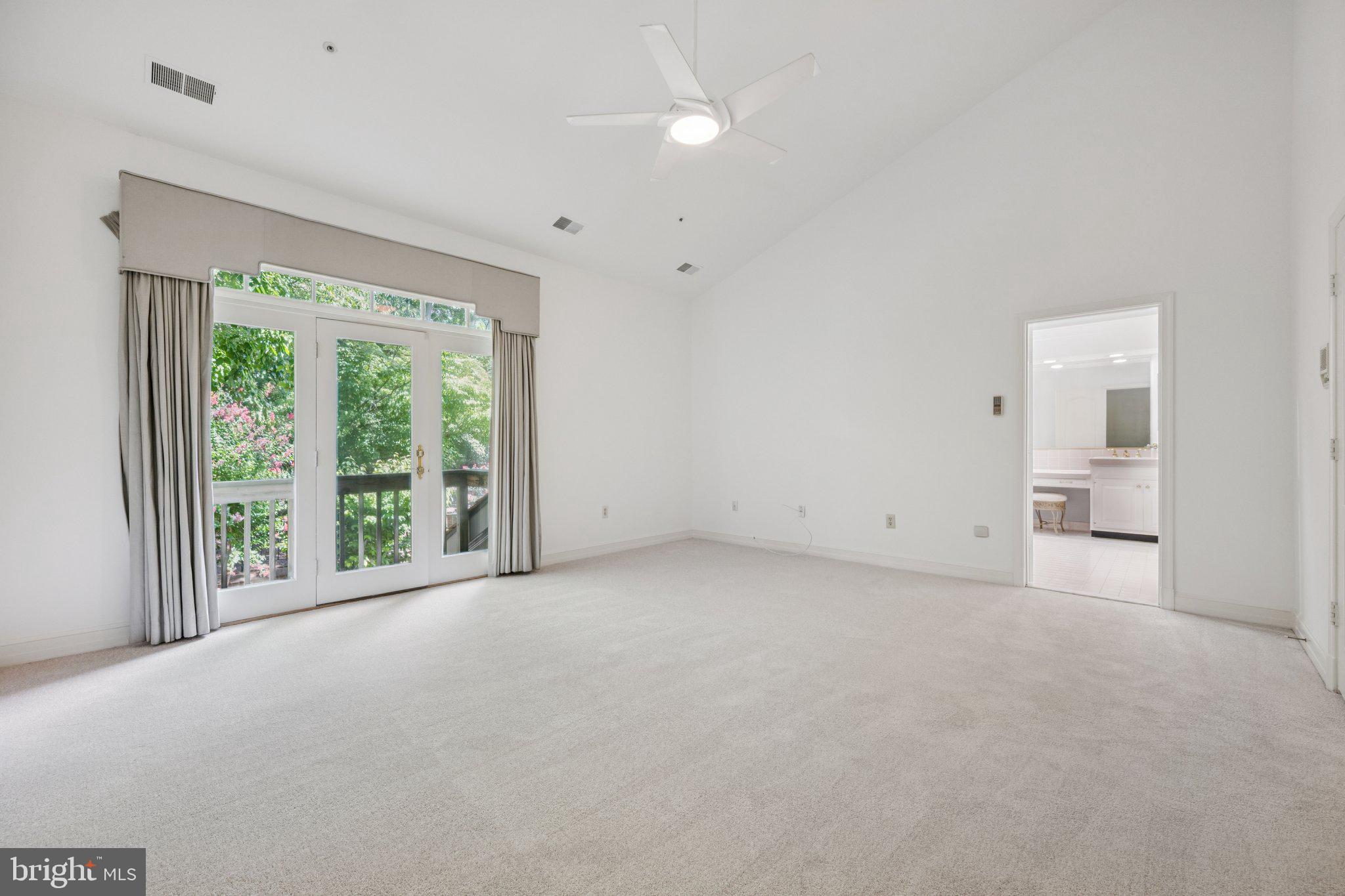 5819 Madaket Road Bethesda, MD 20816 - Photo 22 of 50 a view of a big room with windows and kitchen view
