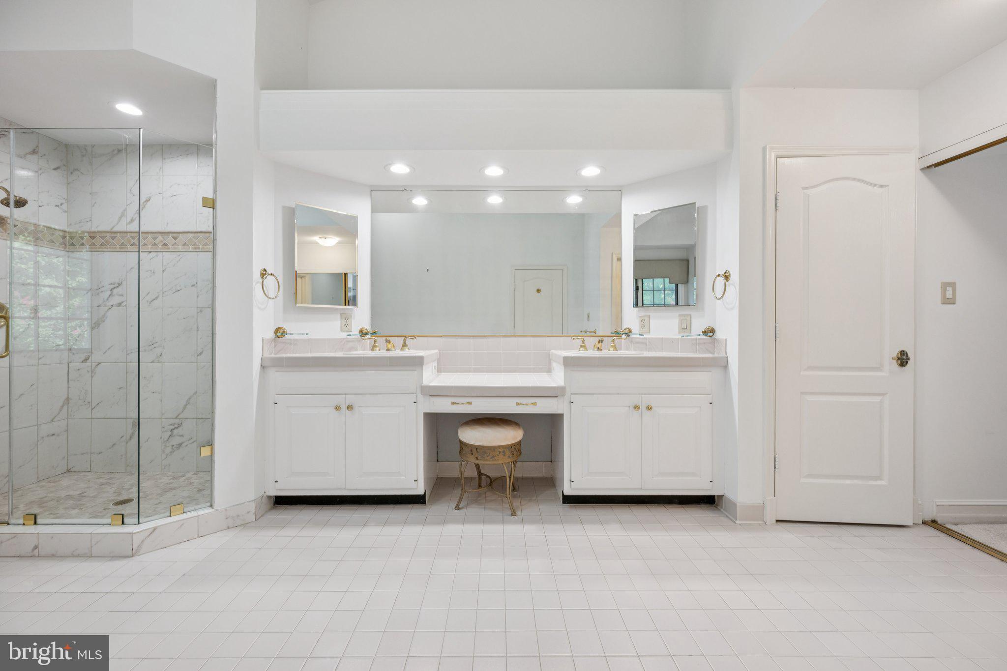 5819 Madaket Road Bethesda, MD 20816 - Photo 24 of 50 a bathroom with a sink a light fixture a vanity and a mirror