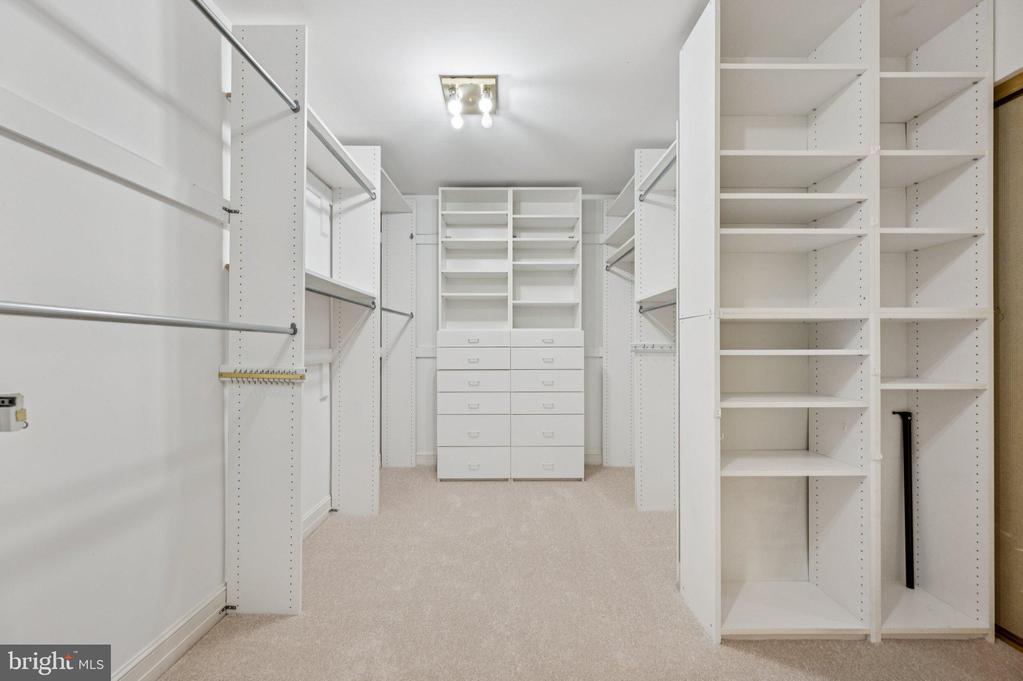 5819 Madaket Road Bethesda, MD 20816 - Photo 25 of 50 a view of walk in closet with empty racks