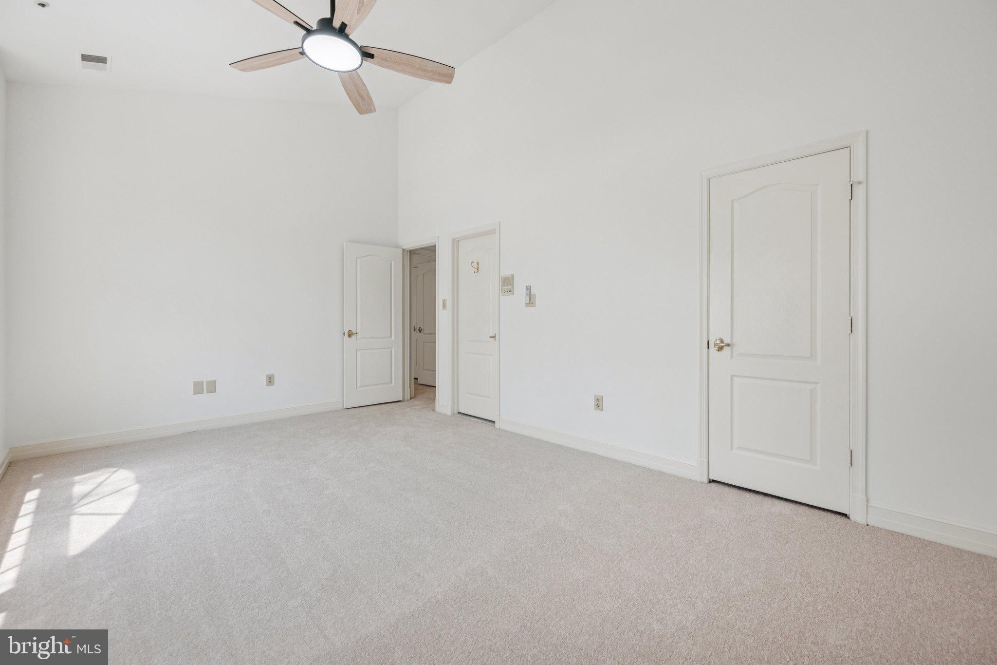 5819 Madaket Road Bethesda, MD 20816 - Photo 27 of 50 an empty room with a ceiling fan and a window