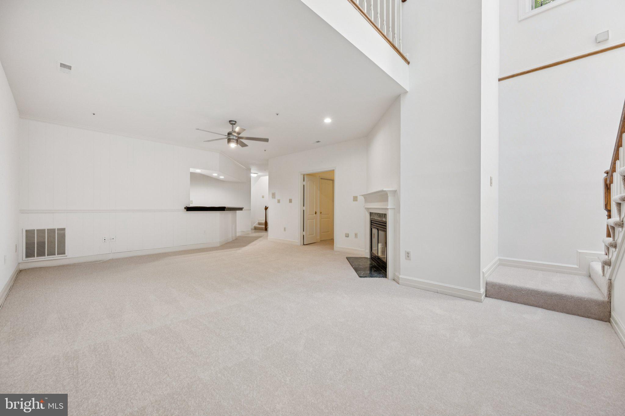 5819 Madaket Road Bethesda, MD 20816 - Photo 36 of 50 a view of a livingroom with kitchen and a window