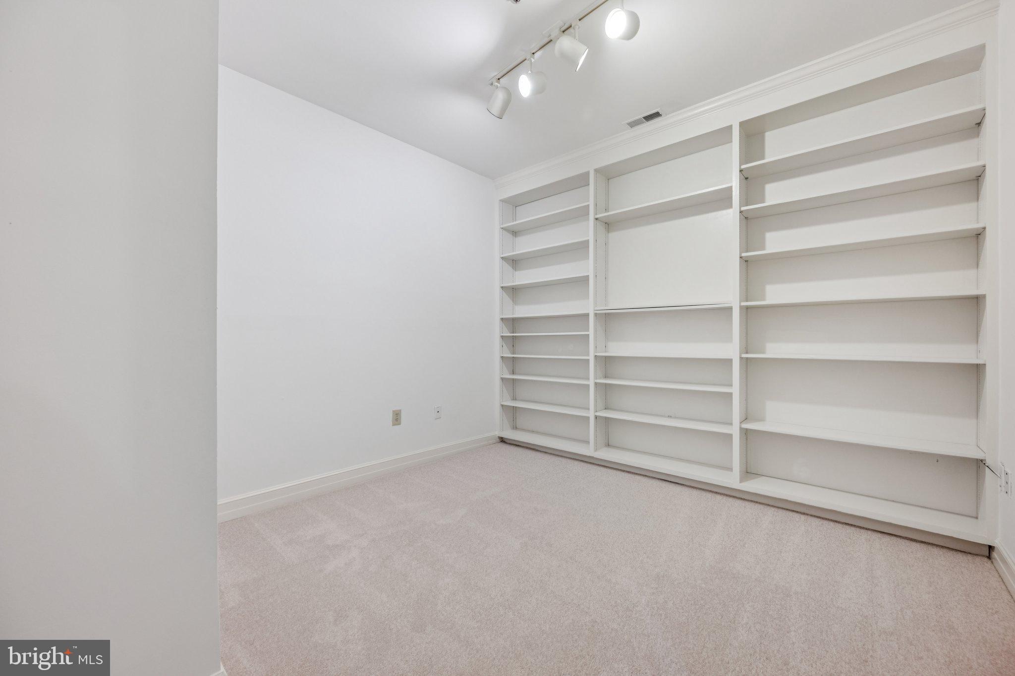 5819 Madaket Road Bethesda, MD 20816 - Photo 39 of 50 a room with walk in closet with empty racks