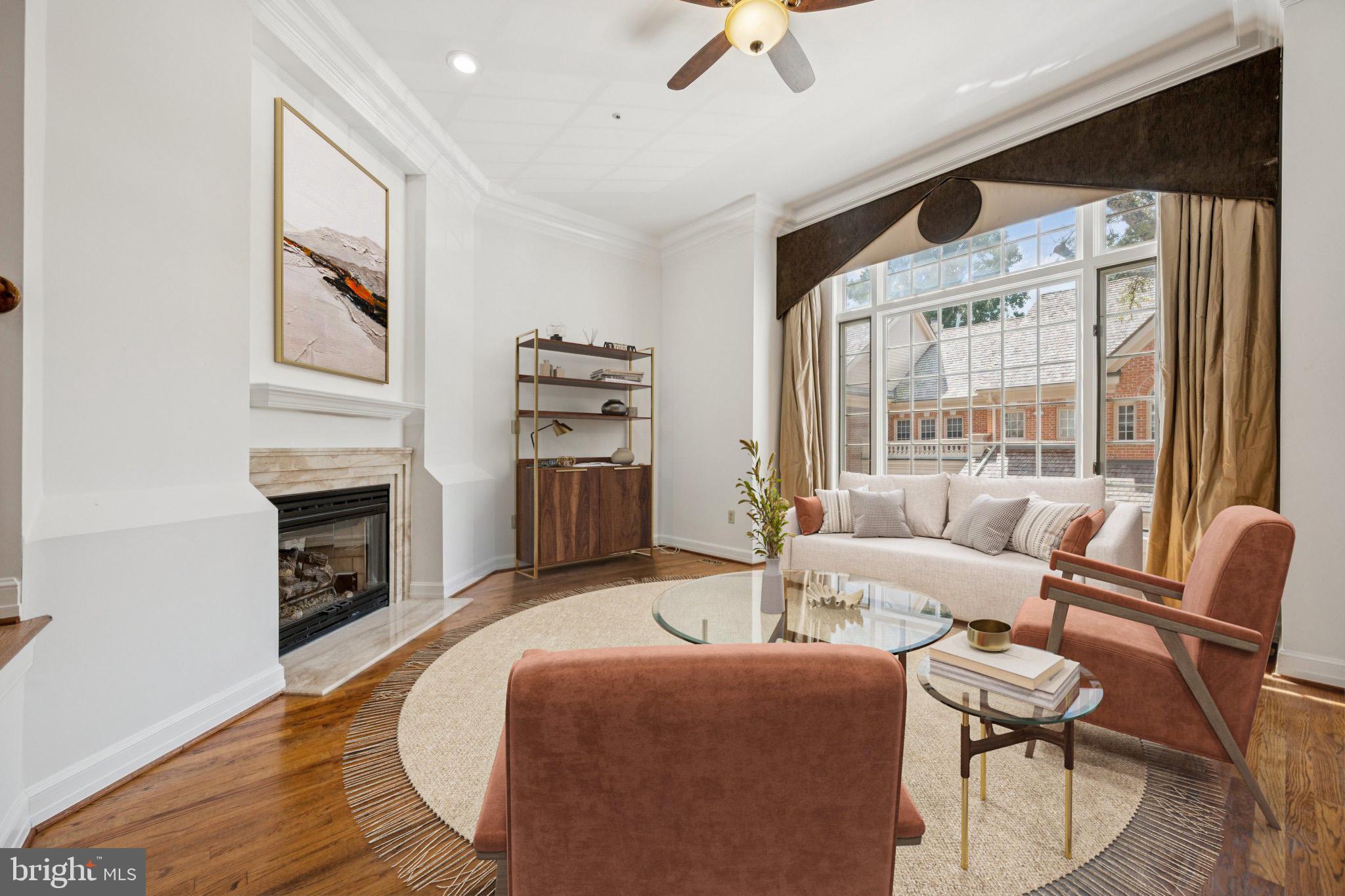 5819 Madaket Road Bethesda, MD 20816 - Photo 4 of 50 a living room with furniture a fireplace and a flat screen tv