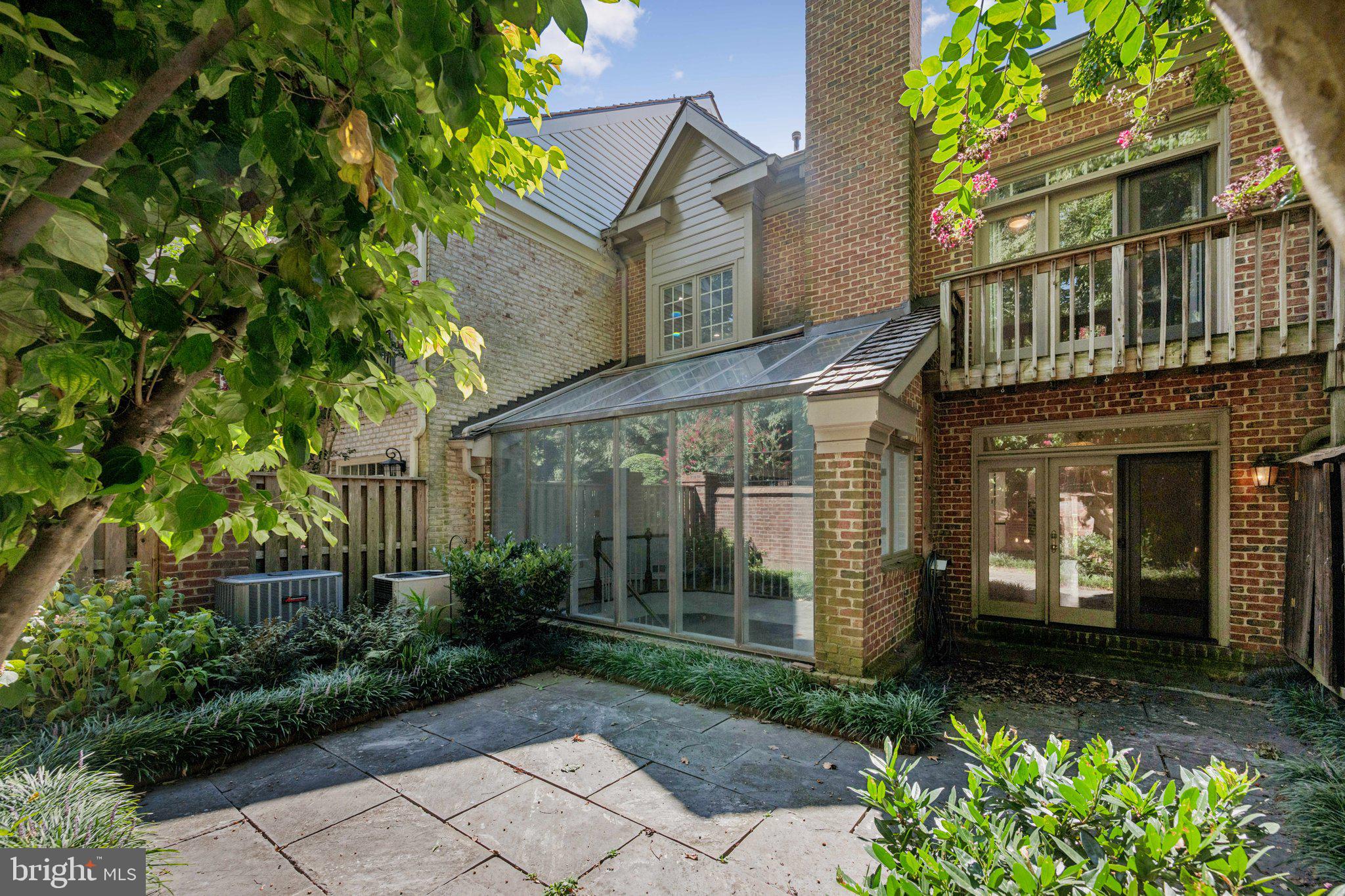 5819 Madaket Road Bethesda, MD 20816 - Photo 43 of 50 a front view of a house with garden