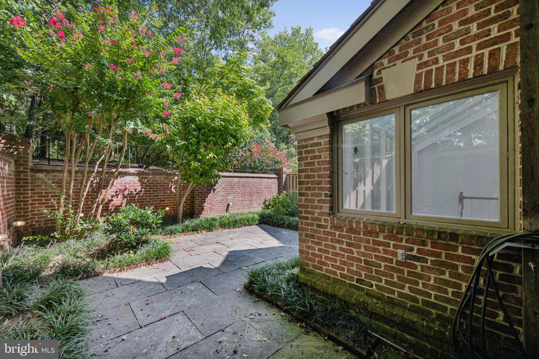 5819 Madaket Road Bethesda, MD 20816 - Photo 45 of 50 a front view of a house with garden