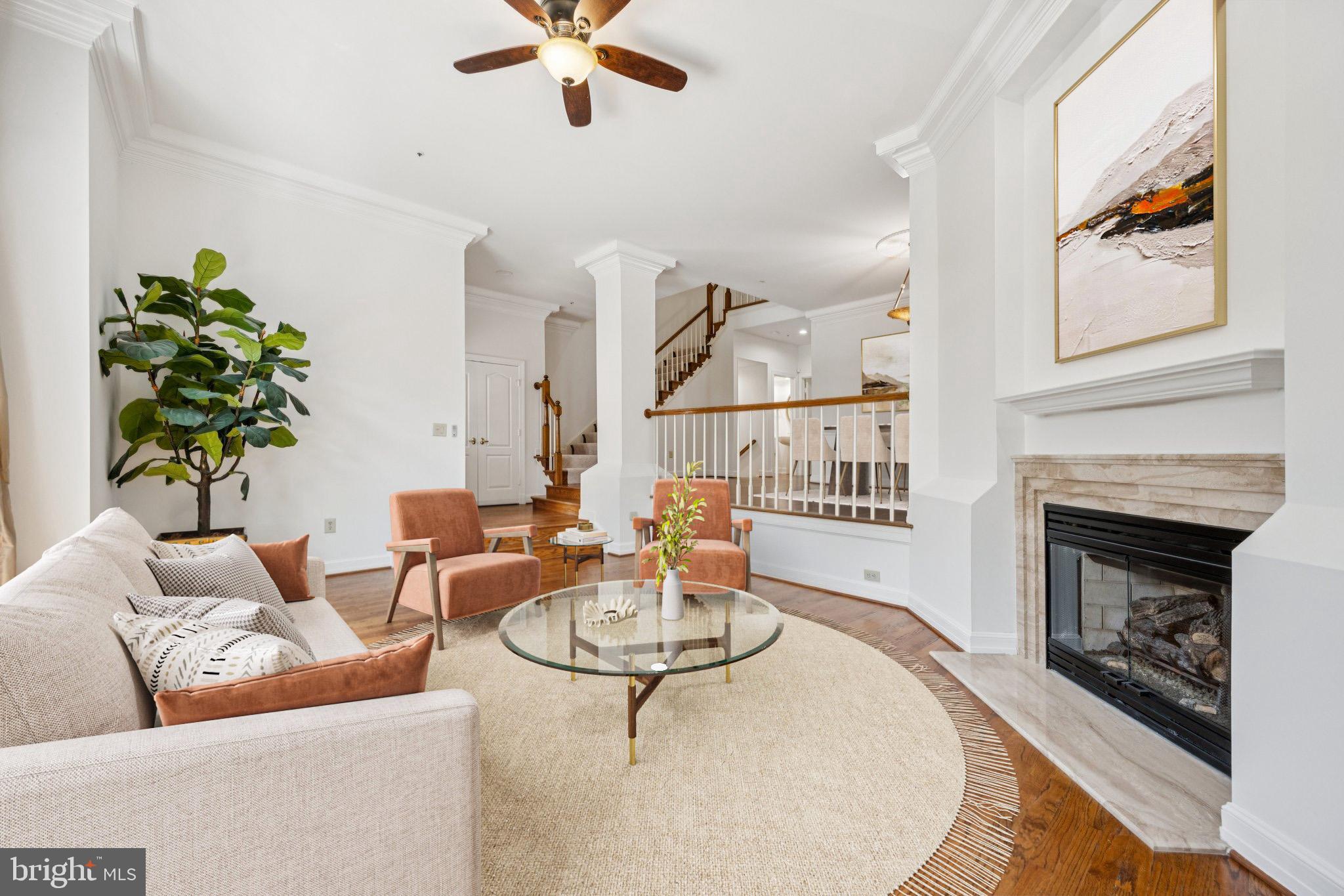 5819 Madaket Road Bethesda, MD 20816 - Photo 6 of 50 a living room with furniture and a fireplace