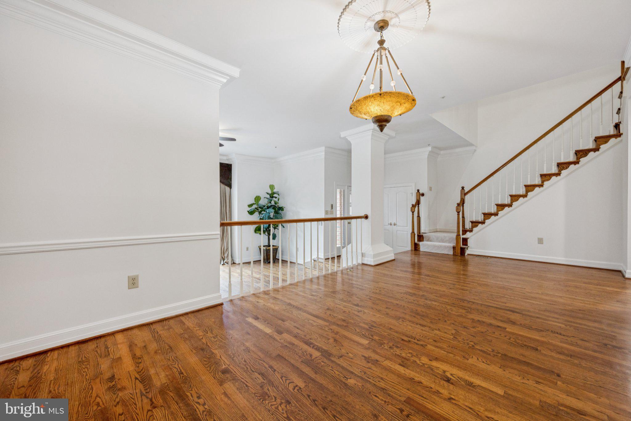 5819 Madaket Road Bethesda, MD 20816 - Photo 9 of 50 a view of entryway and hall with wooden floor