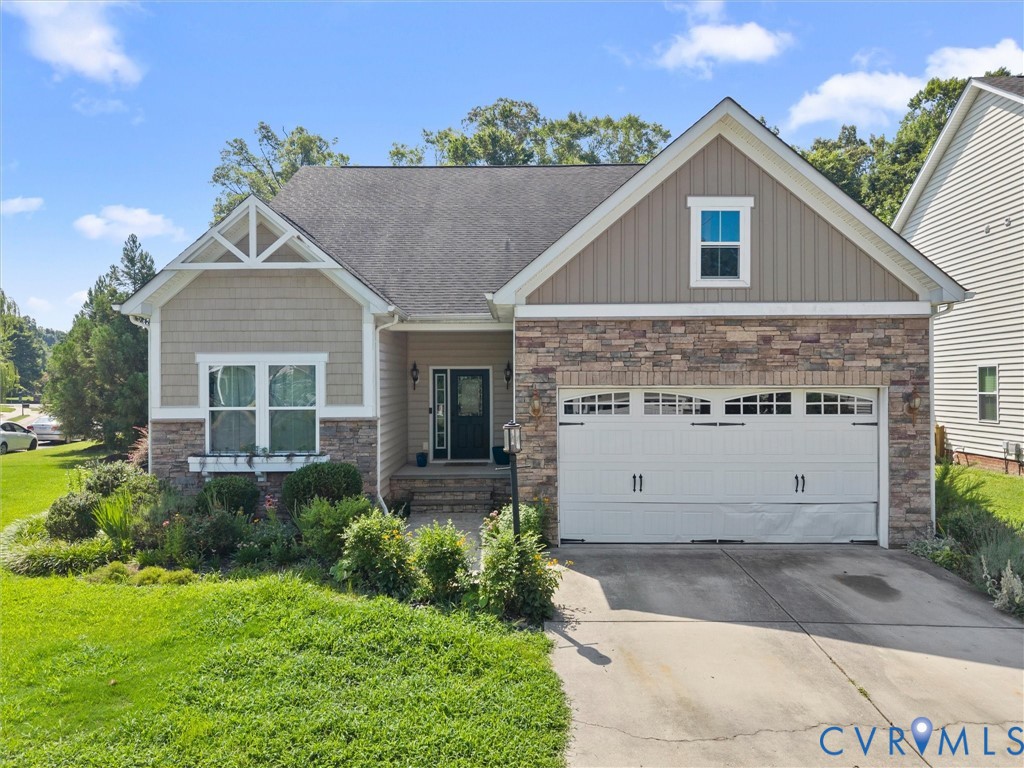 7434 South Franklins Way Quinton, VA 23141 - Photo 1 of 31 Stone and siding exterior featuring a two-car gara