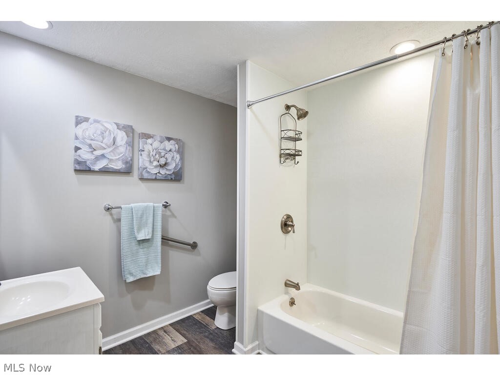 667 Ranney Street Akron, OH 44310 - Photo 18 of 27 Bathroom remodeled with newer cabinet,sink flooring, light fixture and newer tub too!