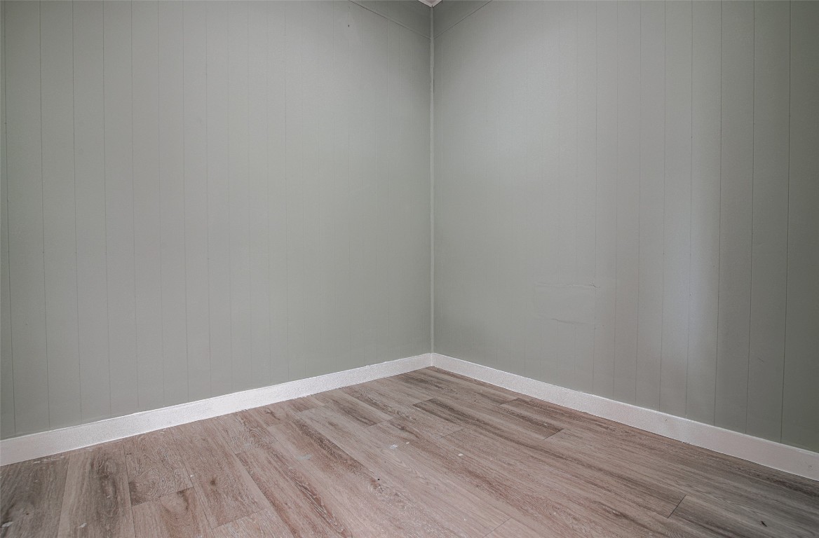 207 Haley Road Johnson City, TX 78636 - Photo 18 of 26 a view of an empty room with wooden floor