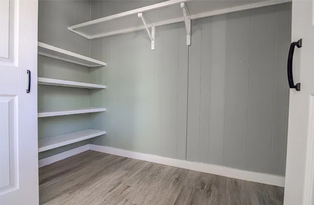 a view of an empty walk in closet