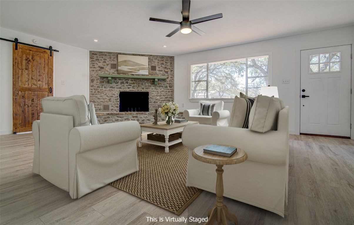 207 Haley Road Johnson City, TX 78636 - Photo 2 of 26 a living room with furniture and a fireplace