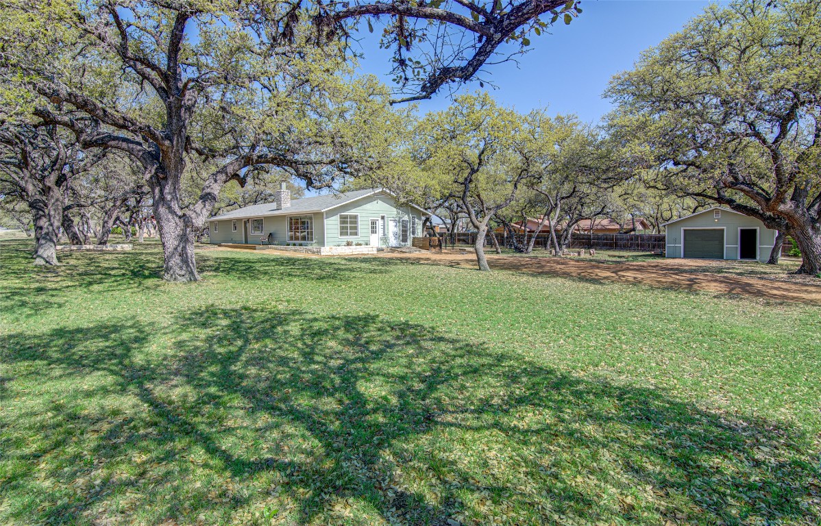 207 Haley Road Johnson City, TX 78636 - Photo 26 of 26 front view of a house with a yard