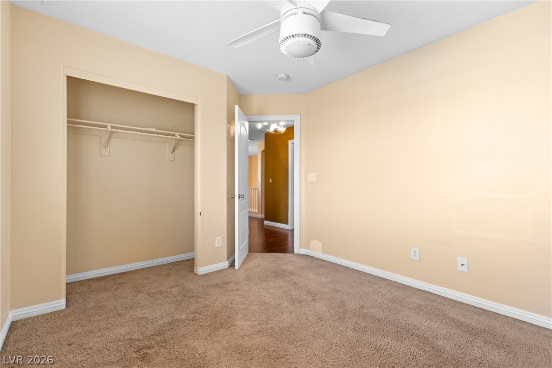 8934 Deep Ridge Court Las Vegas, NV 89178 - Photo 17 of 47 A well-lit bedroom provides ample space and a convenient closet for comfortable living.