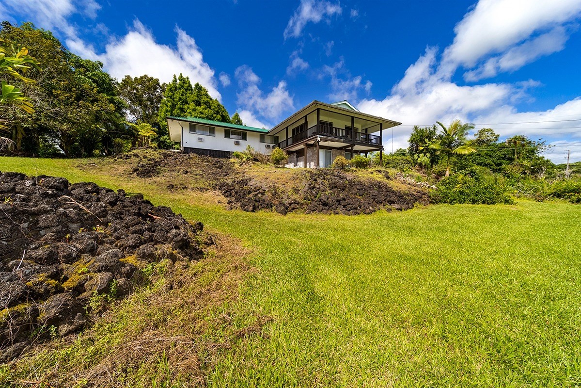 111 Hoaka Road Hilo, HI 96720 - Photo 3 of 21 a front view of a house with a yard