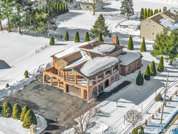 a aerial view of a house with swimming pool
