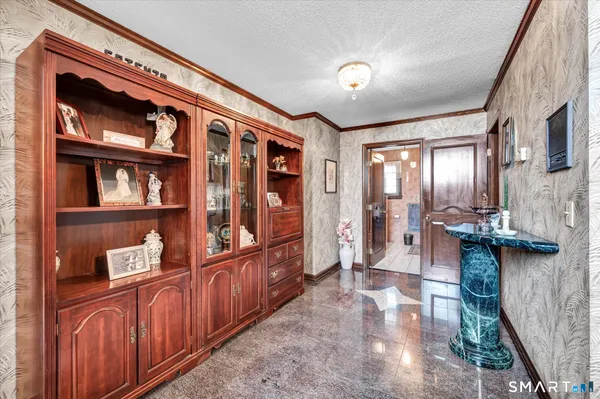 a dining room with furniture a window and wooden floor