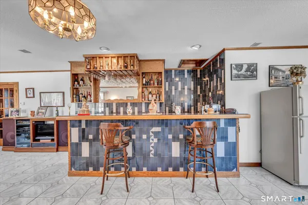 a living room with furniture and large windows