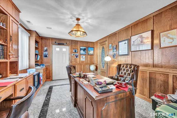 a view of a dining room with furniture window and outside view