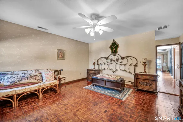a bathroom with a granite countertop shower a sink and dishwasher