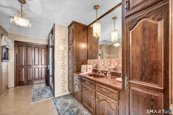 a bathroom with a toilet sink and shower