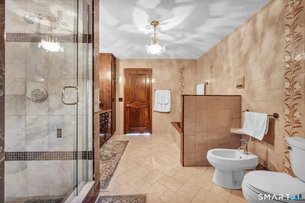 a bedroom with a bed and a dresser in it