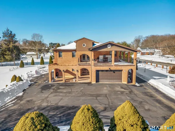 a aerial view of a house with swimming pool
