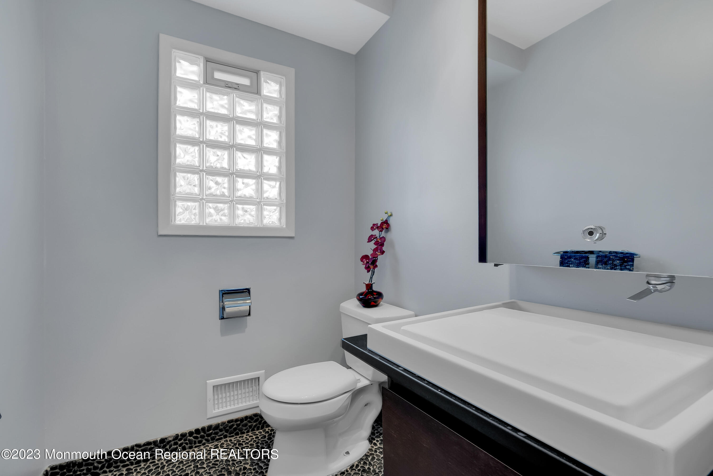 2912 Logan Road Asbury Park, NJ 07712 - Photo 14 of 30 a bathroom with a sink toilet and window